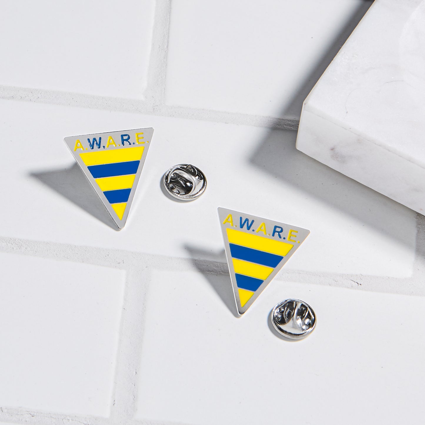 Yellow and Blue AWARE Pins